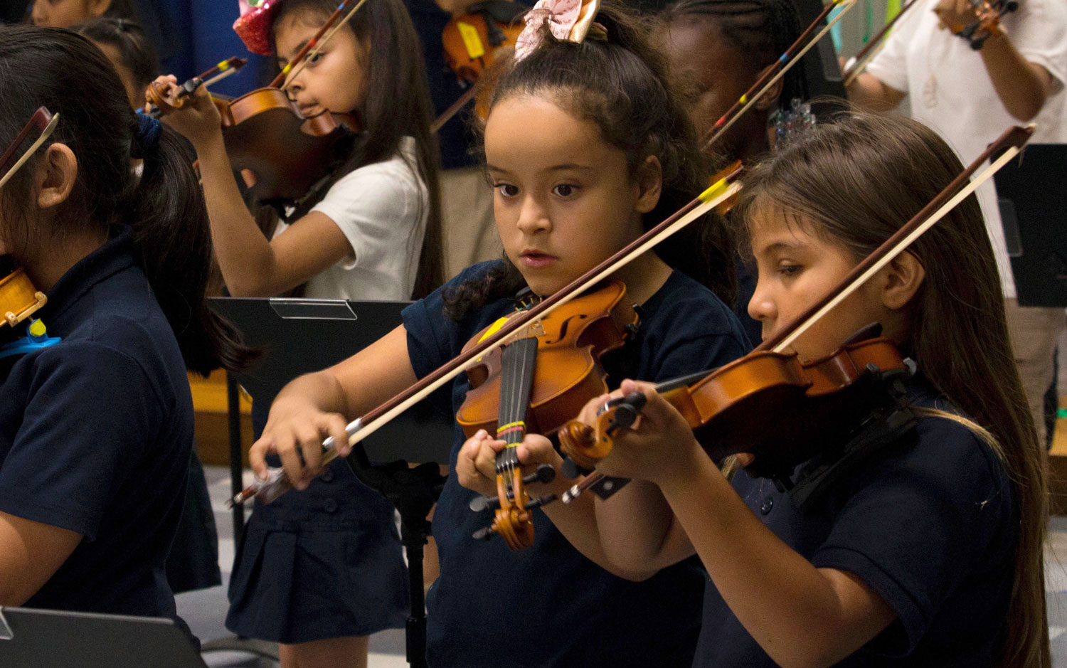 Children playing violins